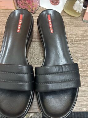 Prada Black Leather Slide Sandals with Red Logo